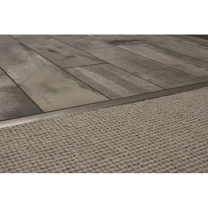 RENO-TK Edge-protection profile with minimum reveal for sloped transitions
