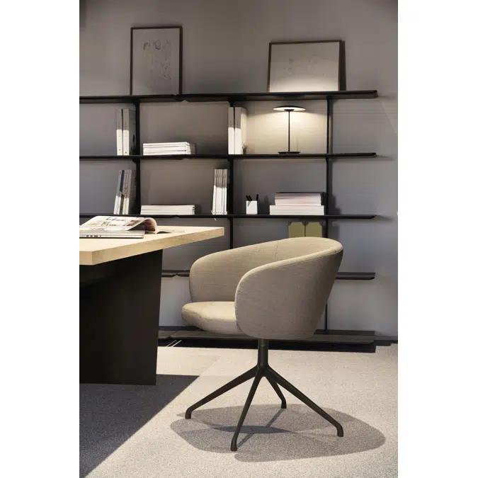 Huma upholstered swivel armchair