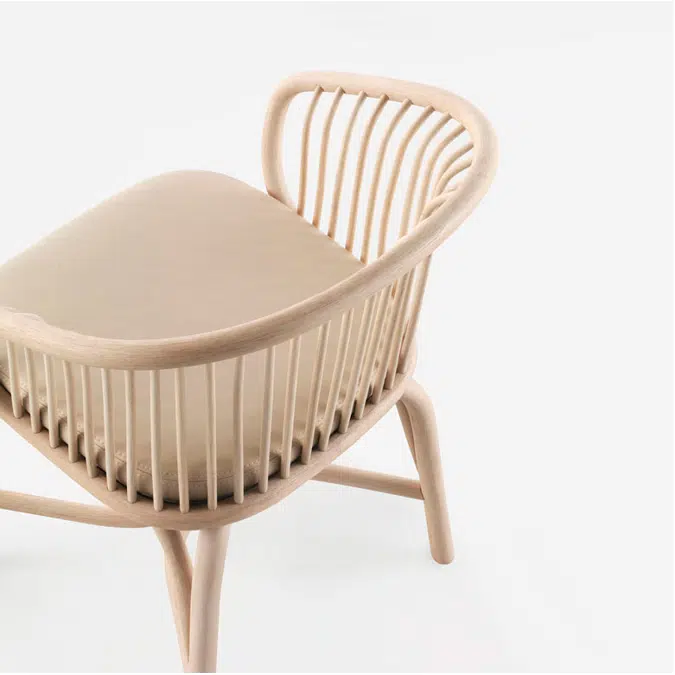 Huma dining armchair with rattan legs